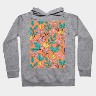 Tropical leaves and flowers botanical pattern in orange Hoodie